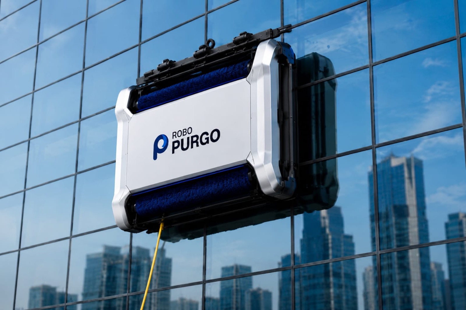 ROBO-PURGO robotic cleaner working on the glass façade of a high-rise tower